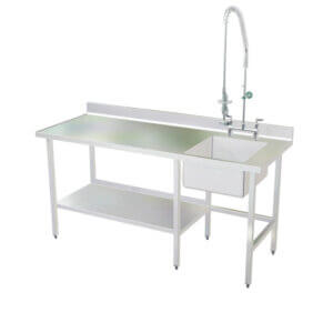 Veterinary stainless steel utility sink and table with backsplash and marine edge.