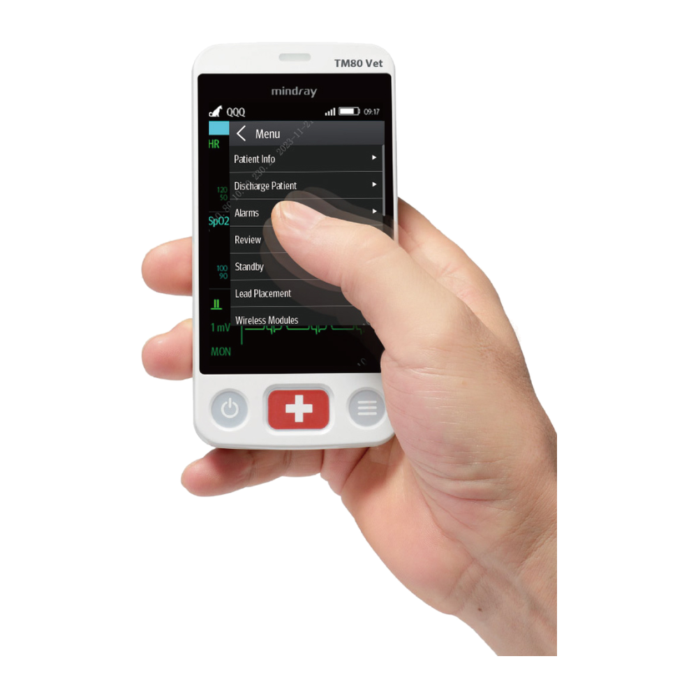 Hand holding a Mindray BeneVision TM80 Vet with its main menu open on the touchscreen