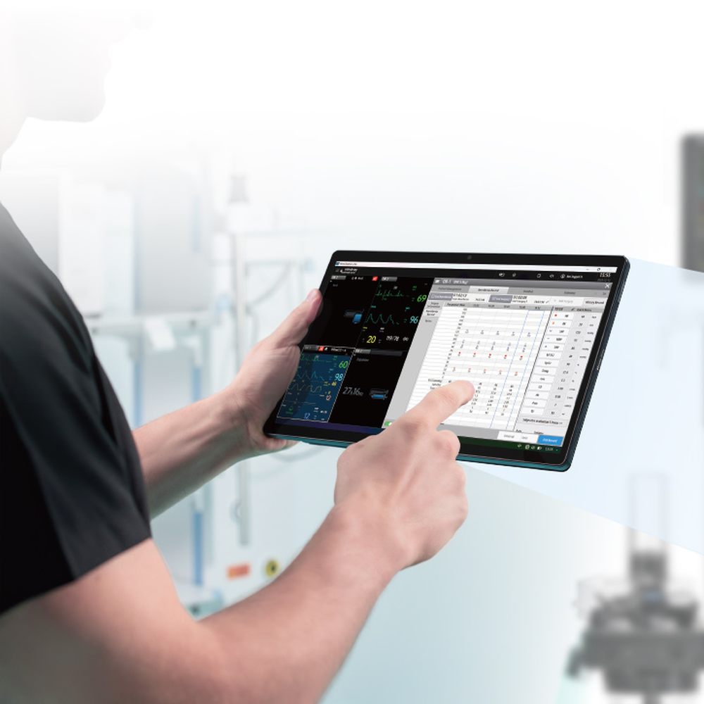 Clinician tapping the VetiNet CMS anesthesia record on a tablet in an operating room